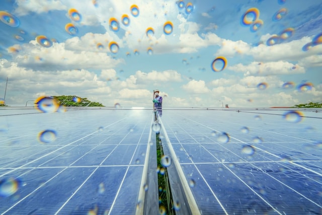 Two solar panels pictured in light rain