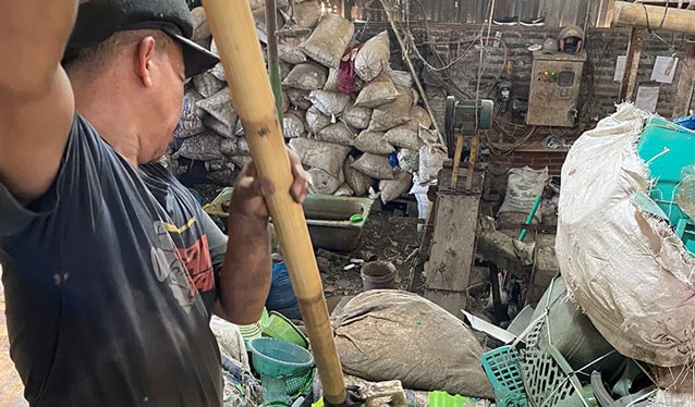 Man organizing waste in Indonesia