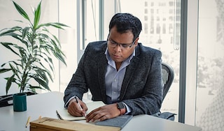 Male executive writing in an office