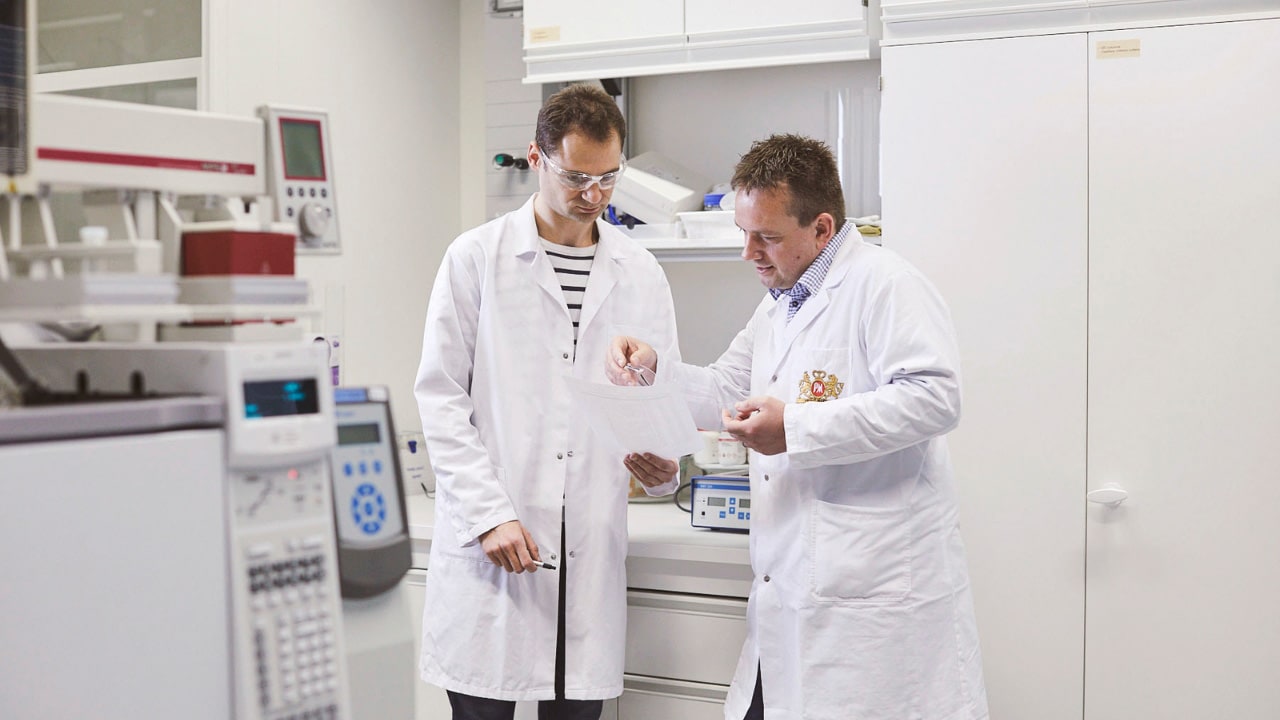 scientists looking at report and talking