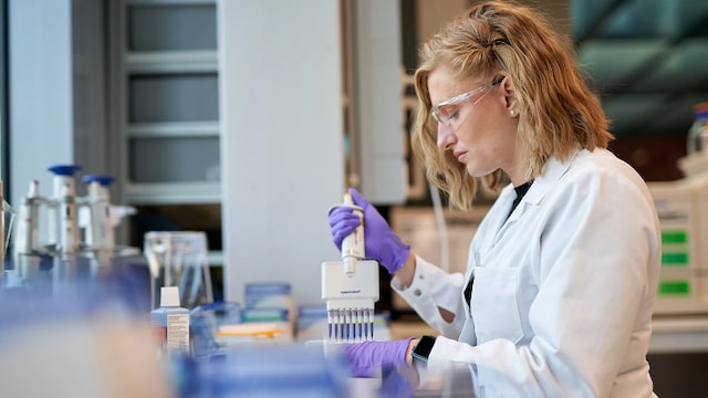 Women working on machine in lab