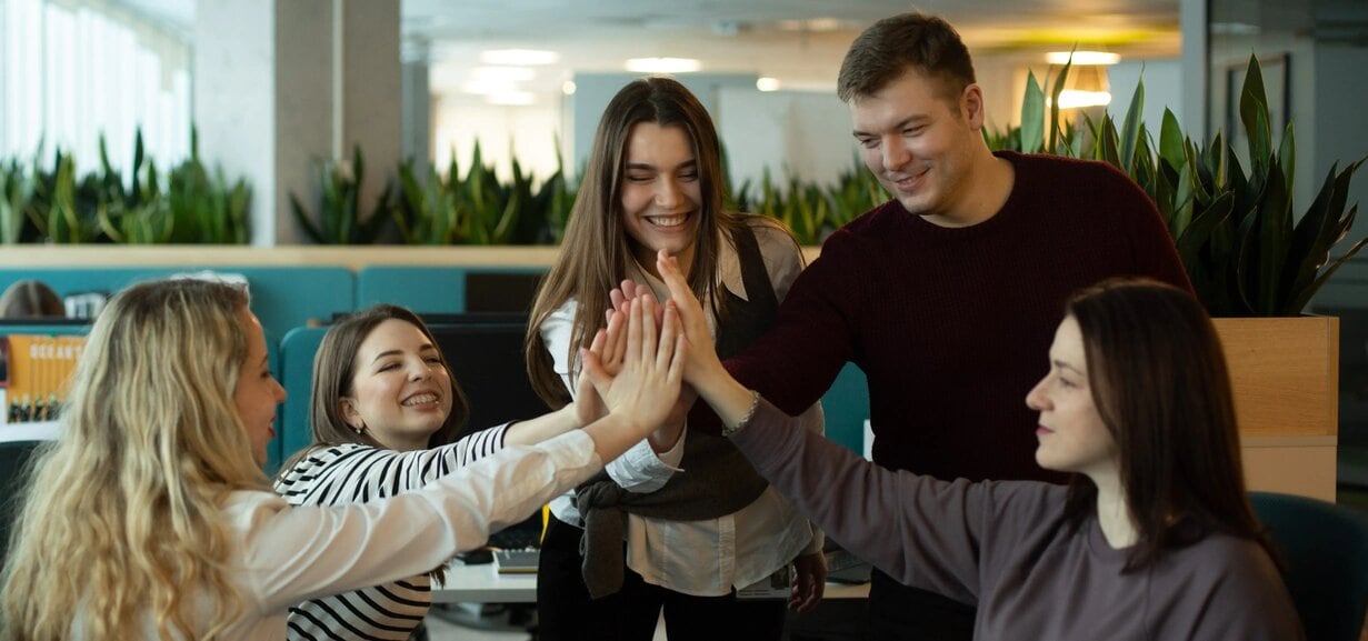 Employees at Philip Morris Ukraine doing high fives