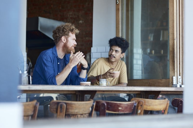 Two men having coffee in a cafe
