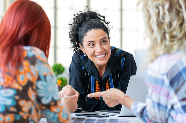 Female work colleagues talking