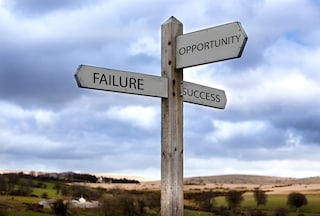 Three way sign with motivational messages, failure, opportunity and success.