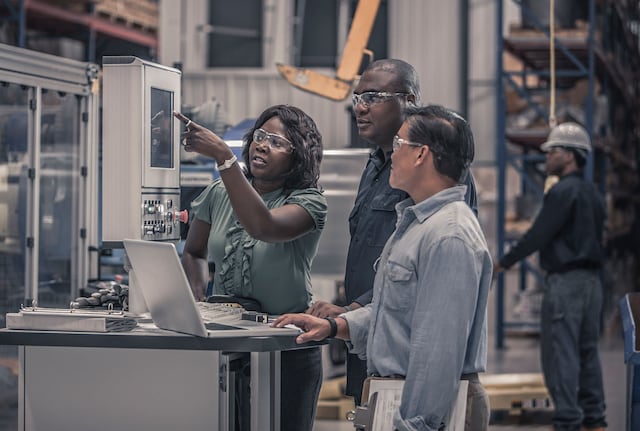 Factory workers in conversation