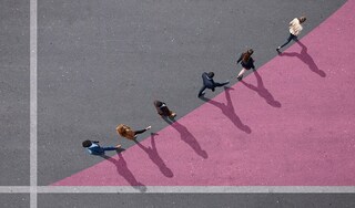 People walking along a line going diagonally upwards