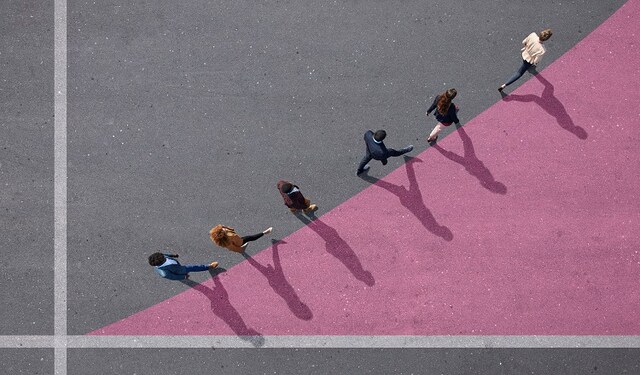 People walking along a line going diagonally upwards