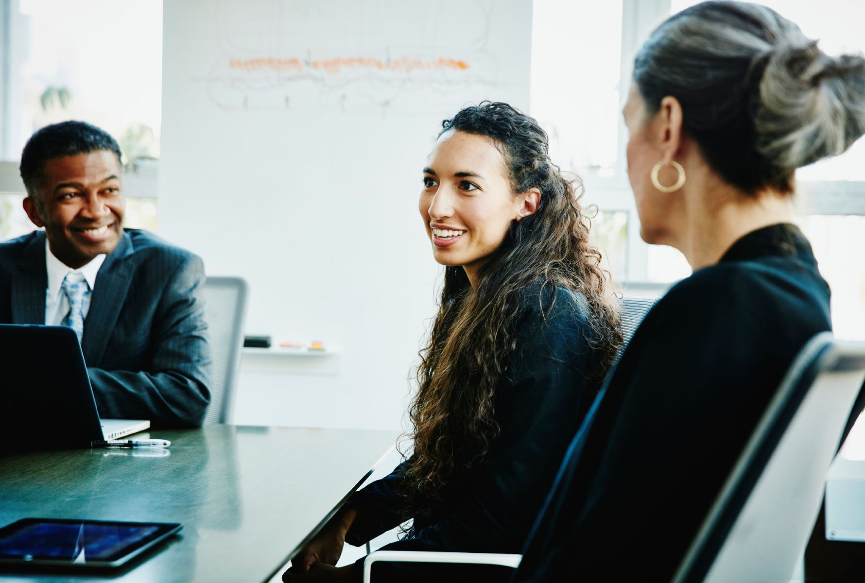 Work colleagues talking in a meeting room