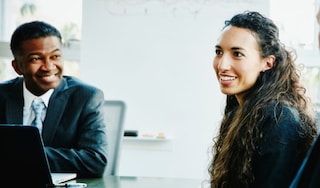 Work colleagues talking in a meeting room