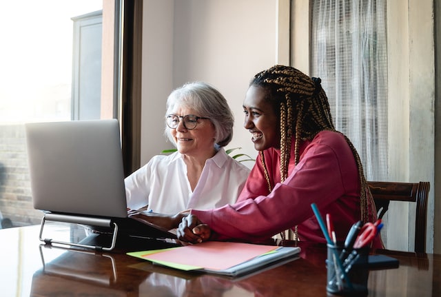 Older and younger colleagues working together