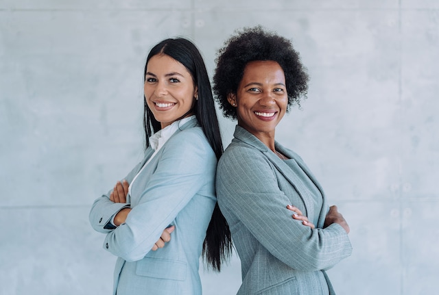 Two businesswomen smiling