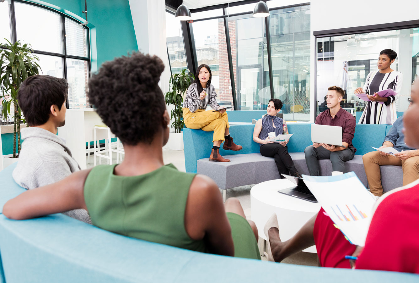 A group of PMI employees in a meeting.