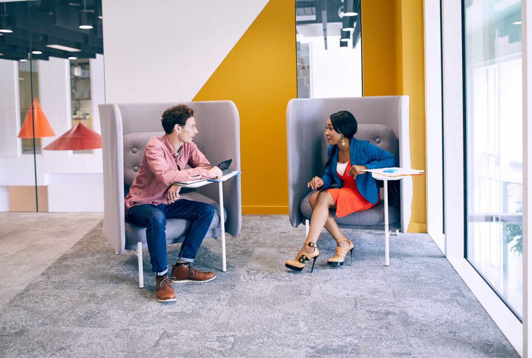 Male and female colleagues in informal meeting