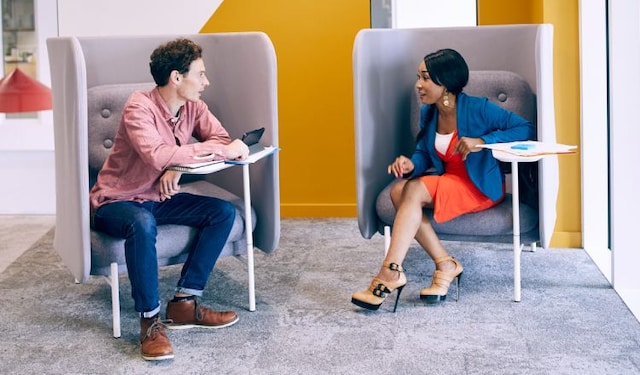 Male and female colleagues in informal meeting