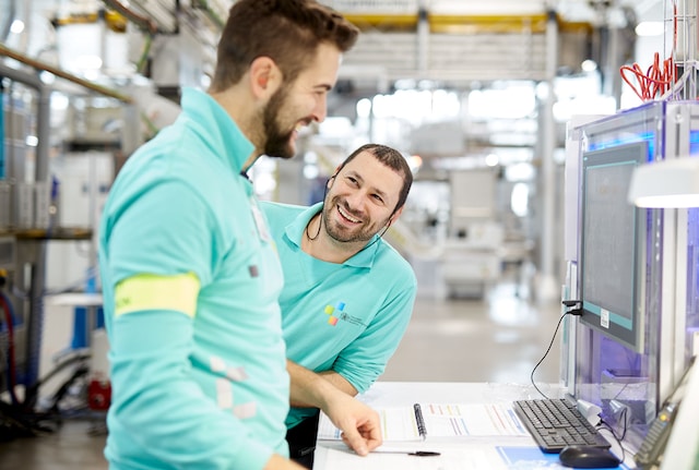 Factory colleagues laughing