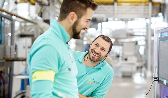 Factory colleagues laughing